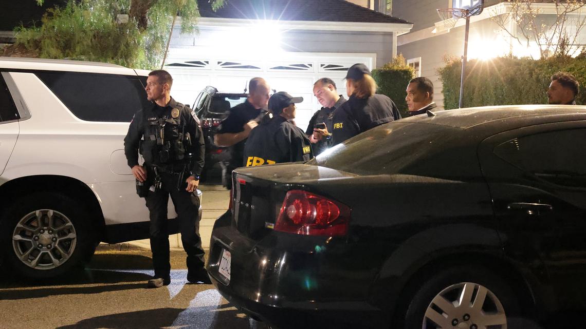 FBI agents arrive on the street of the house connected to Cole Tomas Allen, the shooting suspect at the White House Correspondents' Dinner, in Torrance, California, on Saturday night.
