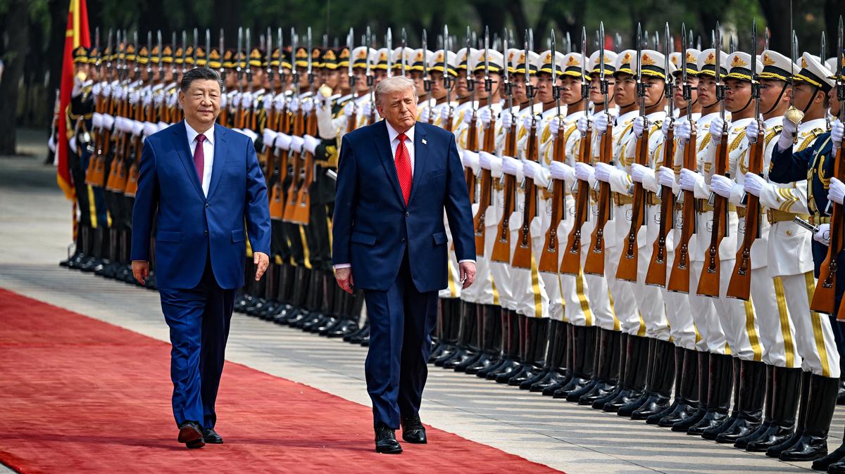 U.S. President Donald Trump reviews the troops with the President of the People’s Republic of China Xi Jinping, in Beijing, China, May 14, 2026, during a trip focused on trade, regional security, and strengthening bilateral ties between the world’s two largest economies. Kenny Holston/Pool via REUTERS