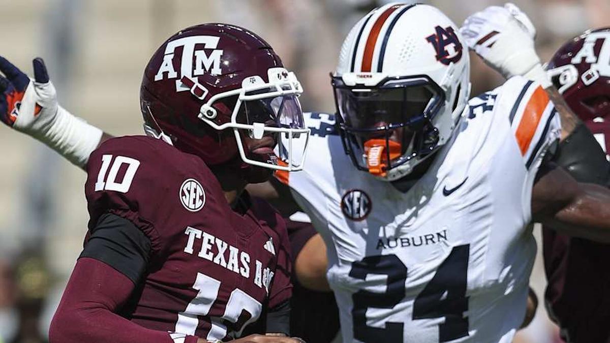  Sep 27, 2025; College Station, Texas, USA; Texas A&M Aggies quarterback Marcel Reed (10) looks for an open receiver as Auburn Tigers defensive end Keyron Crawford (24) applies defensive pressure during the second quarter at Kyle Field. Mandatory Credit: Troy Taormina-Imagn Images | Troy Taormina-Imagn Images 