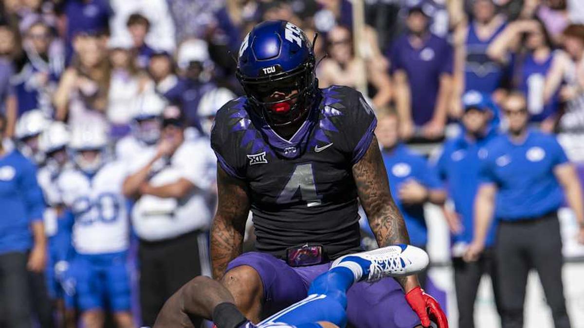  Oct 14, 2023; Fort Worth, Texas, USA; Brigham Young Cougars quarterback Kedon Slovis (10) is sacked by TCU Horned Frogs linebacker Jamoi Hodge (6) as linebacker Namdi Obiazor (4) looks on during the game at Amon G. Carter Stadium. Mandatory Credit: Jerome Miron-Imagn Images | Jerome Miron-Imagn Images 
