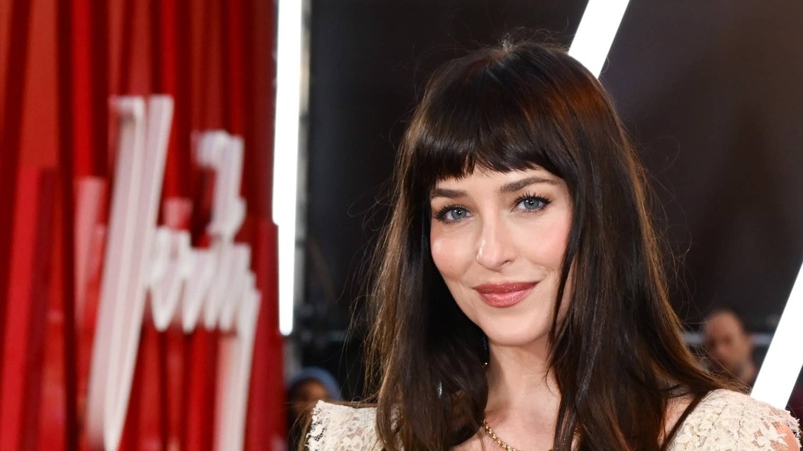 Dakota Johnson Dares To Bare in a Sheer Lace Dress With a Pop Underneath 