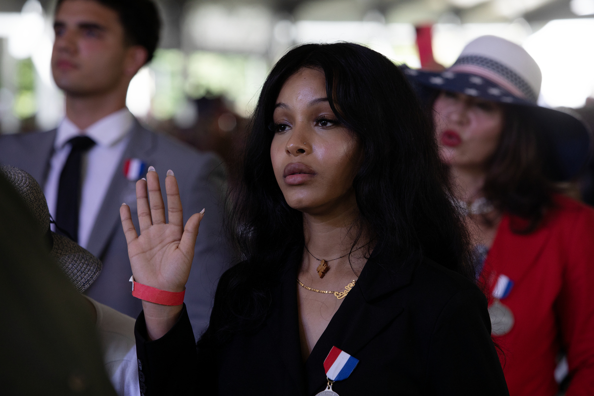 New citizens take the oath at a naturalization ceremony at Monticello in Charlottesville, Va., on July 4. 2026. America celebrates the 250th anniversary of its independence today, with people from one end of the country to the other marking the milestone with fireworks, parades and concerts. (Kirsten Luce/The New York Times)