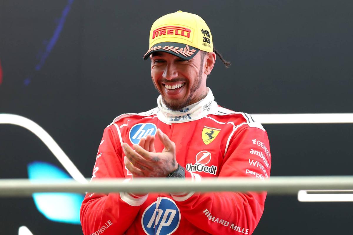  Lewis Hamilton celebrates on the podium at the 2026 F1 Chinese Grand Prix. Dom Gibbons/LAT Images