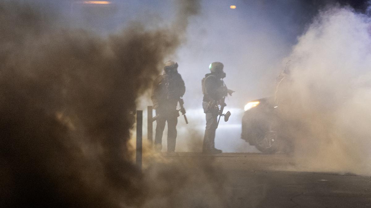 Federal Agents Descend On Minneapolis For Immigration Enforcement Operations. Federal agents launch tear gas at residents protesting a shooting incident on January 14, 2026 in Minneapolis, Minnesota.