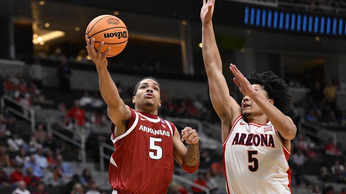  Mar 26, 2026; San Jose, CA, USA; Arkansas Razorbacks guard Darius Acuff Jr. (5) shoots past Arizona Wildcats guard Brayden Burries (5) in the second half during a Sweet Sixteen game of the West Regional of the men's 2026 NCAA Tournament at SAP Center. Mandatory Credit: Eakin Howard-Imagn Images | Eakin Howard-Imagn Images 