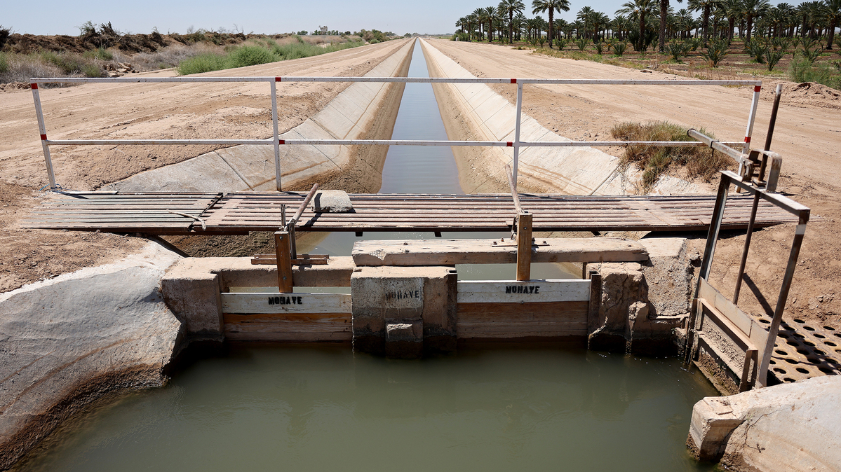 An irrigation ditch carries river water toward Quechan tribal land along the long-depleted Colorado River on May 26, 2023, near Winterhaven, California. (Mario Tama/Getty Images/TNS)