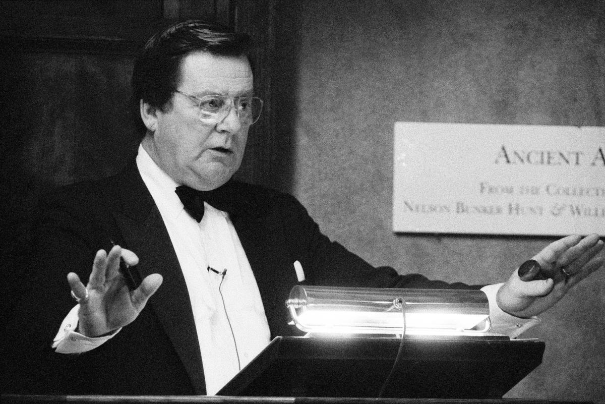 FILE -- John Marion conducts an auction session for antiquities and coins at Sotheby's in Manhattan, June 19, 1990. Marion, who was the public face of the global auction house Sotheby's for more than three decades and was long considered the country's greatest art auctioneer -- the man with the golden gavel, who oversaw multiple record-breaking sales -- died on May 6, 2026, in the La Jolla neighborhood of San Diego. He was 92. (Ángel Franco/The New York Times)