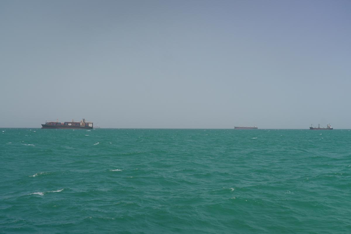 Cargo ships sail in Saudi waters near the Dammam Port in Dammam, Saudi Arabia, May 17, 2026. REUTERS/Mohammed Benmansour