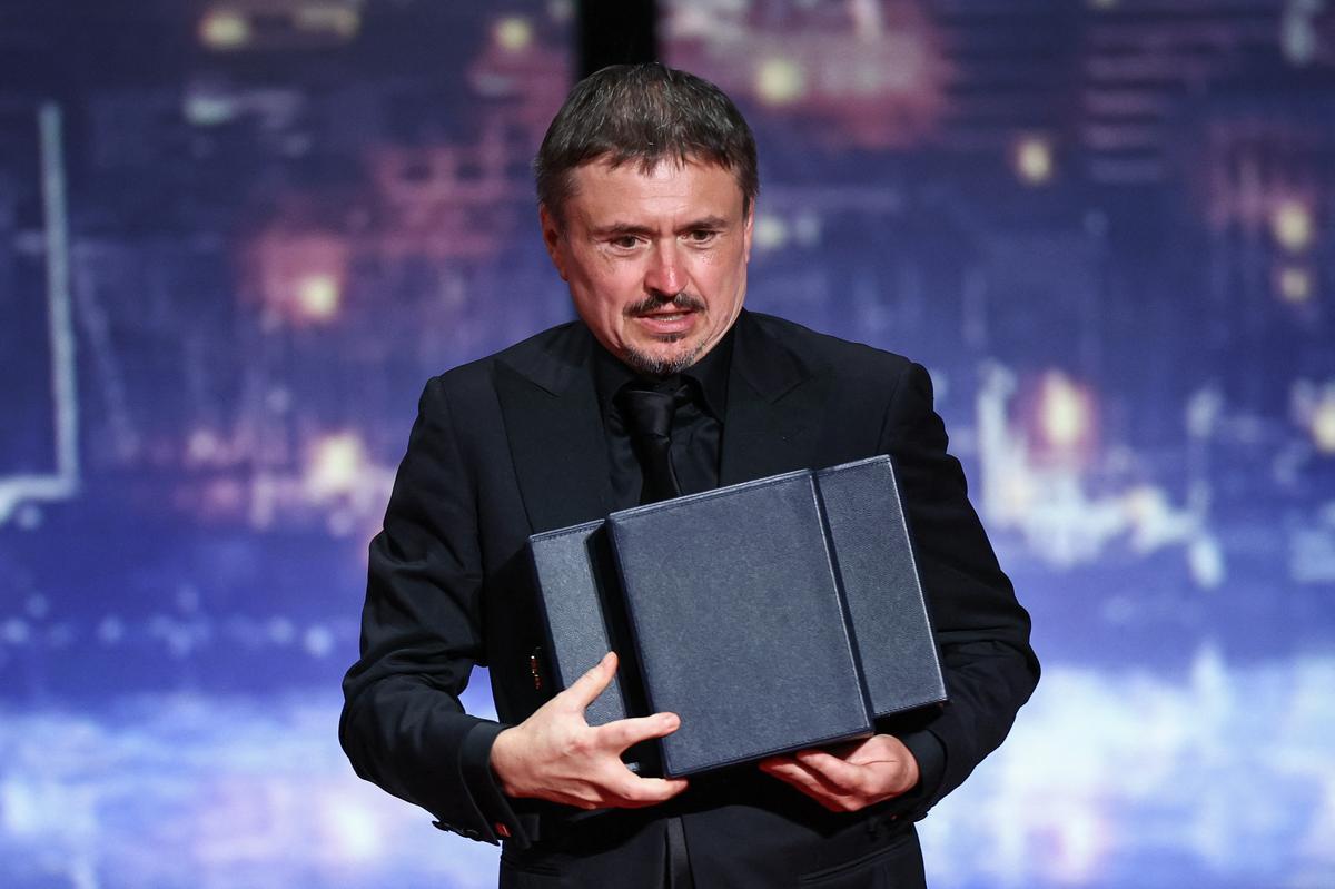 Director Cristian Mungiu, Palme d'Or award winner for the film "Fjord", on stage during the closing ceremony of the 79th Cannes Film Festival in Cannes, France, May 23, 2026. REUTERS/Sarah Meyssonnier