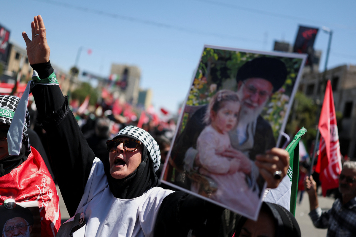 Mourners gather during a funeral procession on the day of the burial of Iran's late Supreme Leader Ayatollah Ali Khamenei, who was killed on February 28 in Israeli and U.S. airstrikes, in Mashhad, Iran, July 9, 2026. REUTERS/Mohammed Salem  Foreign media in Iran operate under guidelines set by the Ministry of Culture and Islamic Guidance, which regulates press activity and permissions.