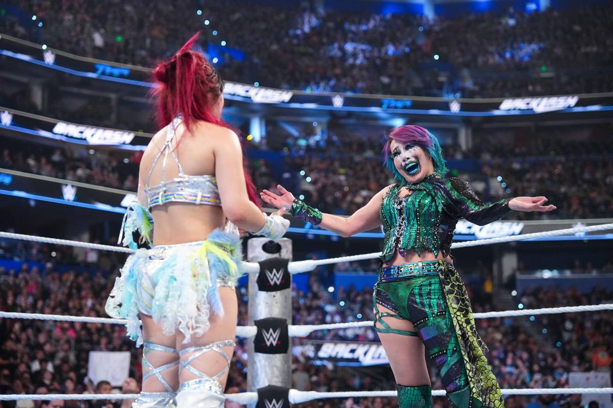  TAMPA, FLORIDA - MAY 9: IYO SKY and Asuka embrace during WWE Backlash at Benchmark International Arena on May 9, 2026 in Tampa, Florida. (Photo by Michael Owens/WWE via Getty Images)