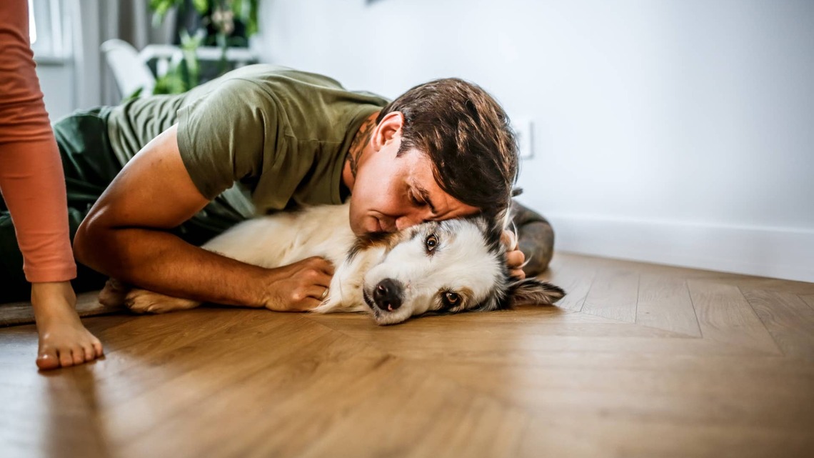 Dog Reaches Up for One Last High Five With Dad Before Saying Goodbye
