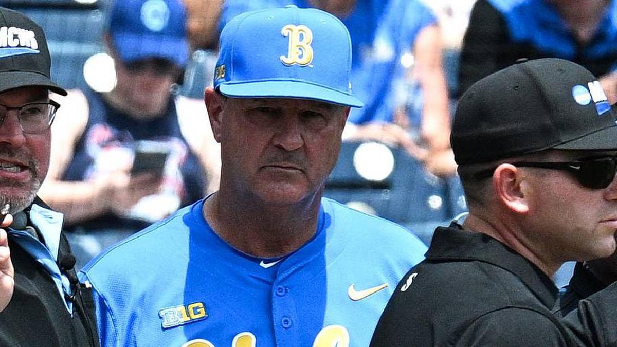  Jun 14, 2025; Omaha, Neb, USA; Murray State Racers head coach Dan Skirka and UCLA Bruins head coach John Savage meet with umpires before the game at Charles Schwab Field. Mandatory Credit: Steven Branscombe-Imagn Images | Steven Branscombe-Imagn Images 