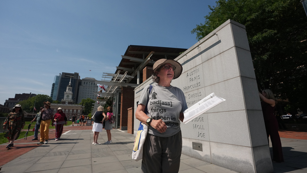 Sheri Utain is on-site to read the information that existed on the previous panels at the President's House, where new panels have been installed, in Philadelphia, July 15, 2026. Historians and advocates have criticized the new panels for minimizing Washington's role as an enslaver. (Jessica Griffin/The Philadelphia Inquirer/TNS)