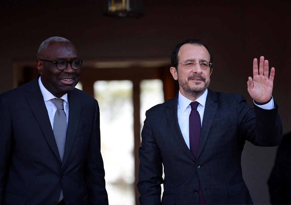 UN Cyprus representative Khassim Diagne and  Cyprus President Nikos Christodoulides, who leads Cyprus's Greek Cypriot community are seen before a meeting with Turkish Cypriot leader Tufan Erhurman in the UN buffer zone of the capital Nicosia, Cyprus February 24, 2026. REUTERS/Yiannis Kourtoglou