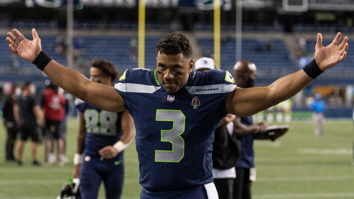 FILE - Seattle Seahawks quarterback Russell Wilson gestures as he walks off the field after an NFL preseason football game against the Los Angeles Chargers, Saturday, Aug. 28, 2021, in Seattle. The Seahawks won 27-0. The Seattle Seahawks have agreed to trade nine-time Pro Bowl quarterback Russell Wilson to the Denver Broncos for a massive haul of draft picks and players, two people familiar with the negotiations confirmed to The Associated Press on Tuesday, March 8, 2022. The people spoke on condition of anonymity because the blockbuster trade, which is pending Wilson passing a physical, can’t become official until the start of the new league year on March 16. (AP Photo/Stephen Brashear, File)