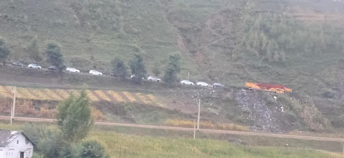 Cars on the road near the city of Hyesan, North Korea, in this picture taken at the China side of the border in Changbai County, Jilin province, China, September 29, 2025. JOUNG EUN-LEE/via REUTERS