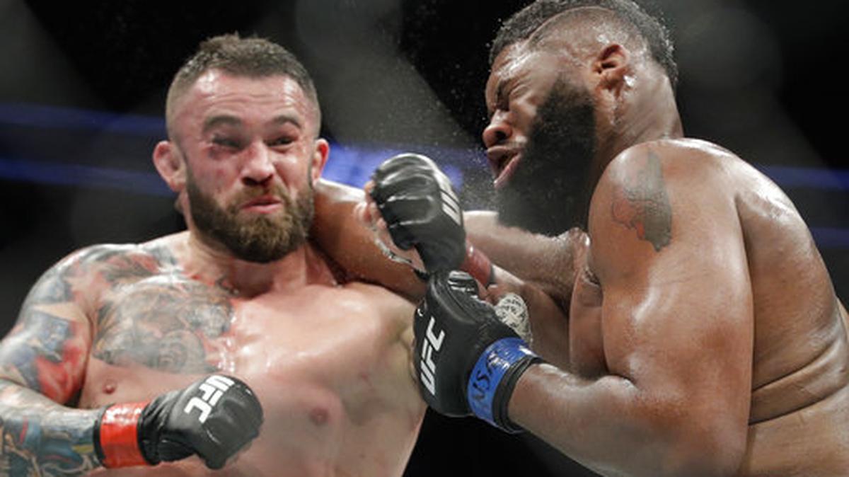 File- This July 8, 2017, file photo shows Daniel Omielanczuk, left, hitting Curtis Blaydes in a heavyweight mixed martial arts bout at UFC 213, in Las Vegas. The UFC is set to use a technology platform that could enhance the way fans watch fights. The world’s leading mixed martial arts promotion has reached a partnership with Heed. The joint venture between WME-IMG and AGT International wants to change the way fans connect with sports at home or at a live event through sensor-measured data.