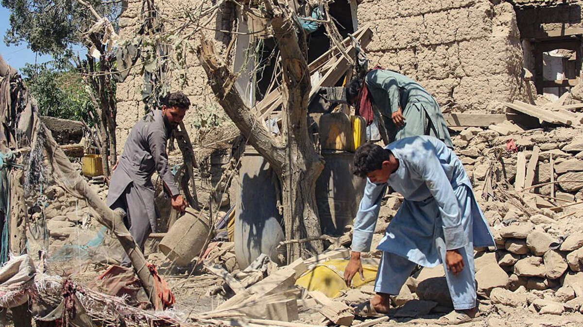 Afghan residents clear the debris of a house damaged by a Pakistani airstrike at Shultan district in Kunar province on Wednesday. Pakistan has renewed deadly airstrikes on neighboring Afghanistan, officials in both countries said, in the worst violence in weeks following a period of relative calm.