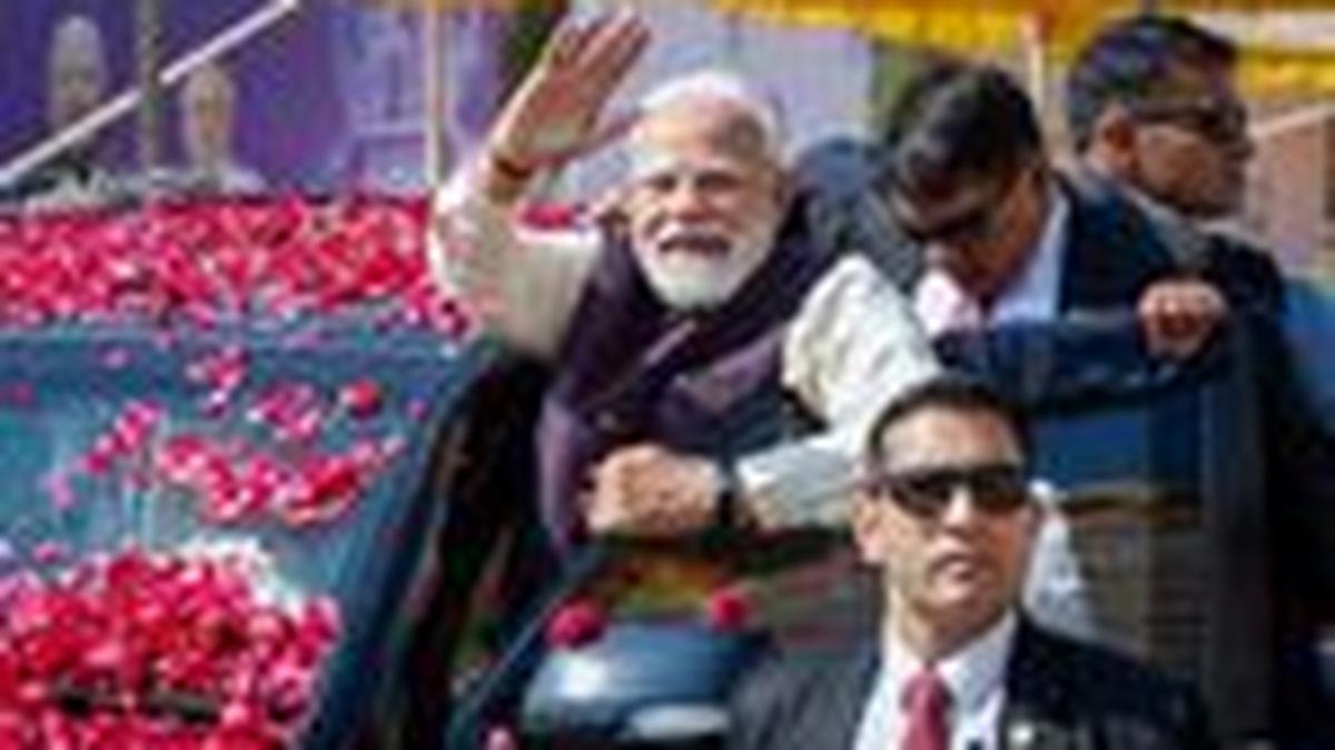 India's Prime Minister Narendra Modi waves to the crowd as he arrives to inaugurate Micron Technology's semiconductor assembly and testing plant in Sanand, Gujarat, India, February 28, 2026. REUTERS/Amit Dave