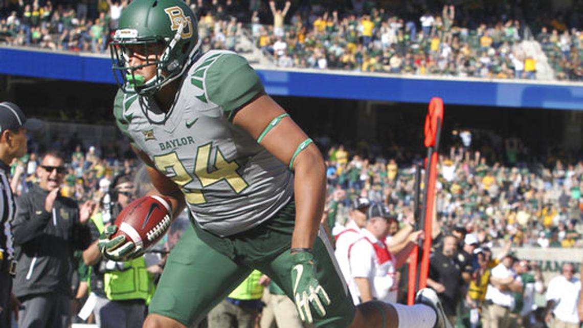 Baylor tight end Ishmail Wainright, left, scores past Iowa State defensive back Reggie Wilkerson, right, in the first half of a NCAA college football game, Saturday, Nov. 18, 2017, in Waco, Texas.
