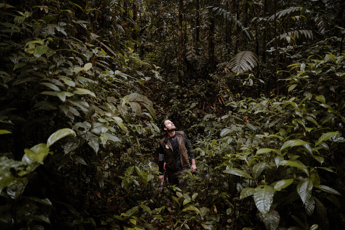 The American scientist Alex Bentley on a hunt for snake specimens in a nature reserve in Mera, Ecuador, maintained by the country's National Institute of Biodiversity on April 5, 2026. Bentley says he was "blown away" by the snake collection asembled by local farmer Manuel Genaro Peñafiel. (Johanna Alarcon/The New York Times)