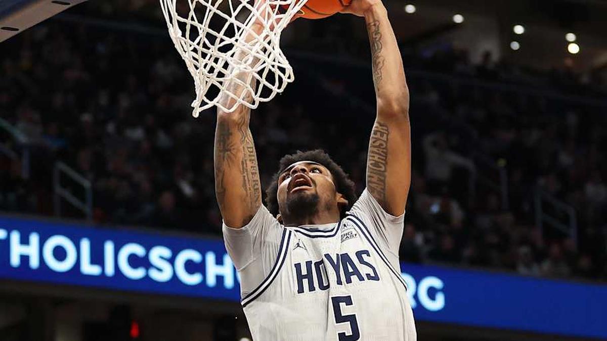  Jan 17, 2026; Washington, District of Columbia, USA; Georgetown Hoyas guard KJ Lewis (5) dunks during the first half against the UConn Huskies at Capital One Arena. Mandatory Credit: Daniel Kucin Jr.-Imagn Images | Daniel Kucin Jr.-Imagn Images 