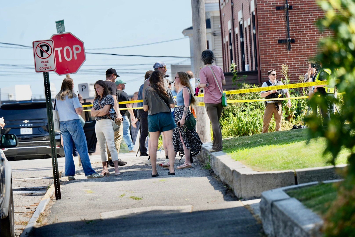 Investigators are seen in Biddeford, Maine July 13, 2026 following reports of a fatal shooting.