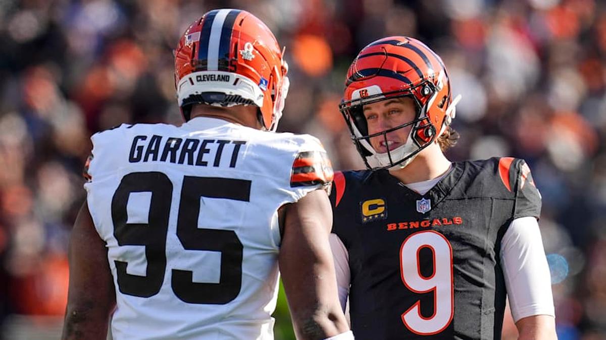  Jan 4, 2026; Cincinnati, Ohio, USA; Cincinnati Bengals quarterback Joe Burrow (9) and Cleveland Browns defensive end Myles Garrett (95) talk between plays in the first quarter at Paycor Stadium. Mandatory Credit: Sam Greene-USA TODAY Network via Imagn Images | Sam Greene-USA TODAY Network via Imagn Images 
