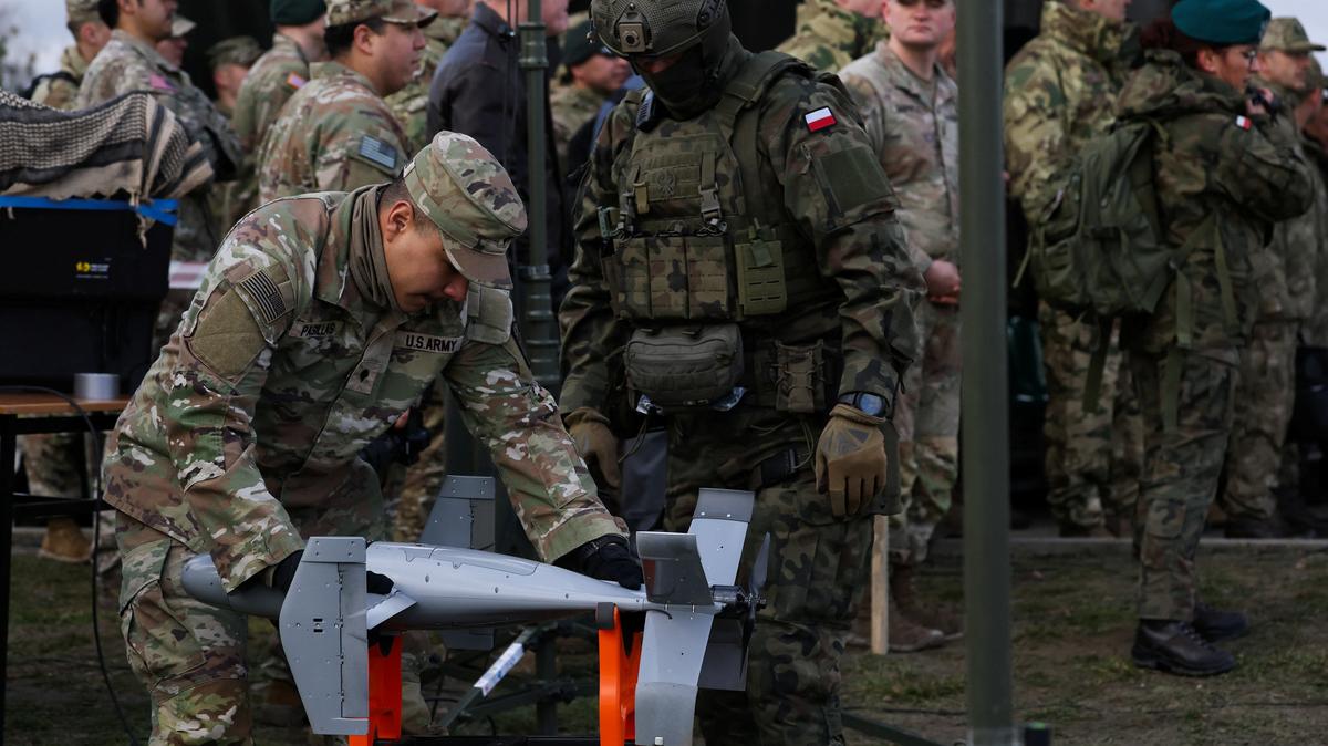 A U.S. soldier handles an AS3 interceptor, part of a modular American-made AI-powered counter-drone system MEROPS, during a presentation at a polygon in Nowa Deba, Poland, November 18, 2025. REUTERS/Kacper Pempel