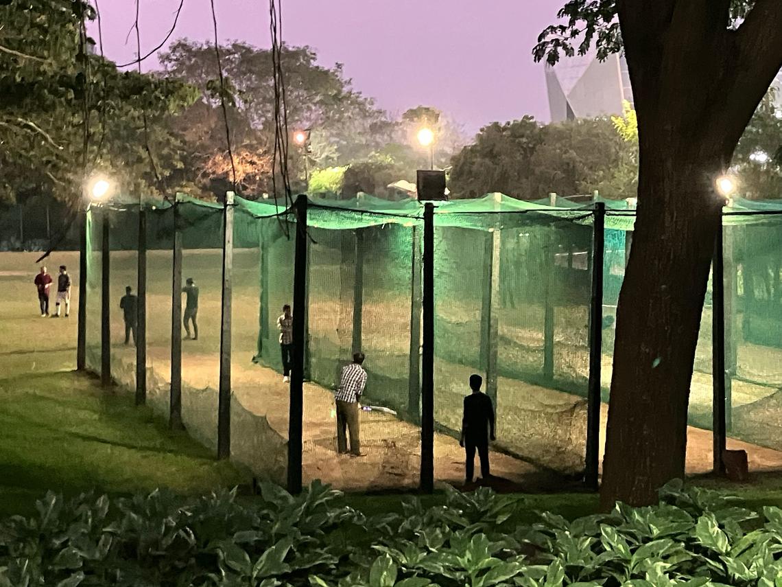  Campus amenities include a giant cricket pitch and nets, where trainees practice in the evenings after class. Credit: Ben Wildavsky
