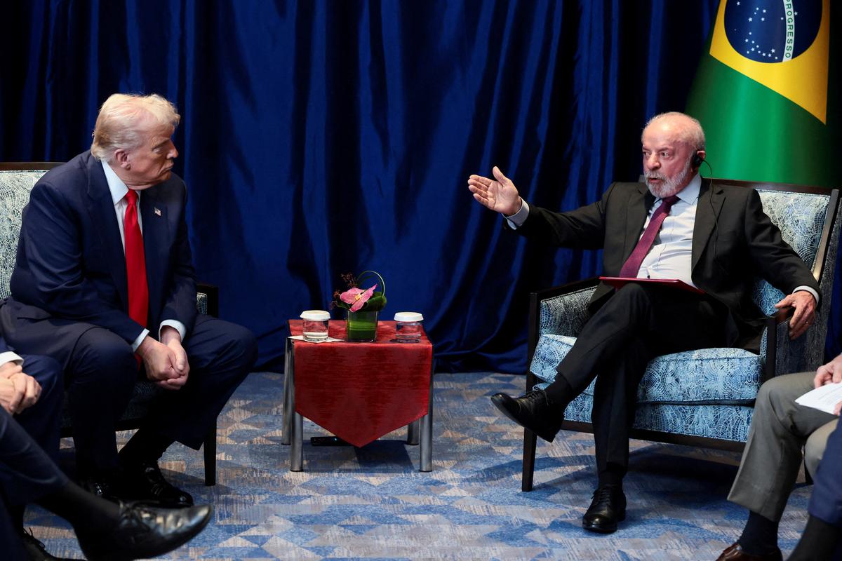 FILE PHOTO: U.S. President Donald Trump and Brazilian President Luiz Inacio Lula da Silva meet on the sidelines of the 47th Association of Southeast Asian Nations (ASEAN) summit in Kuala Lumpur, Malaysia, October 26, 2025. REUTERS/Evelyn Hockstein/File Photo