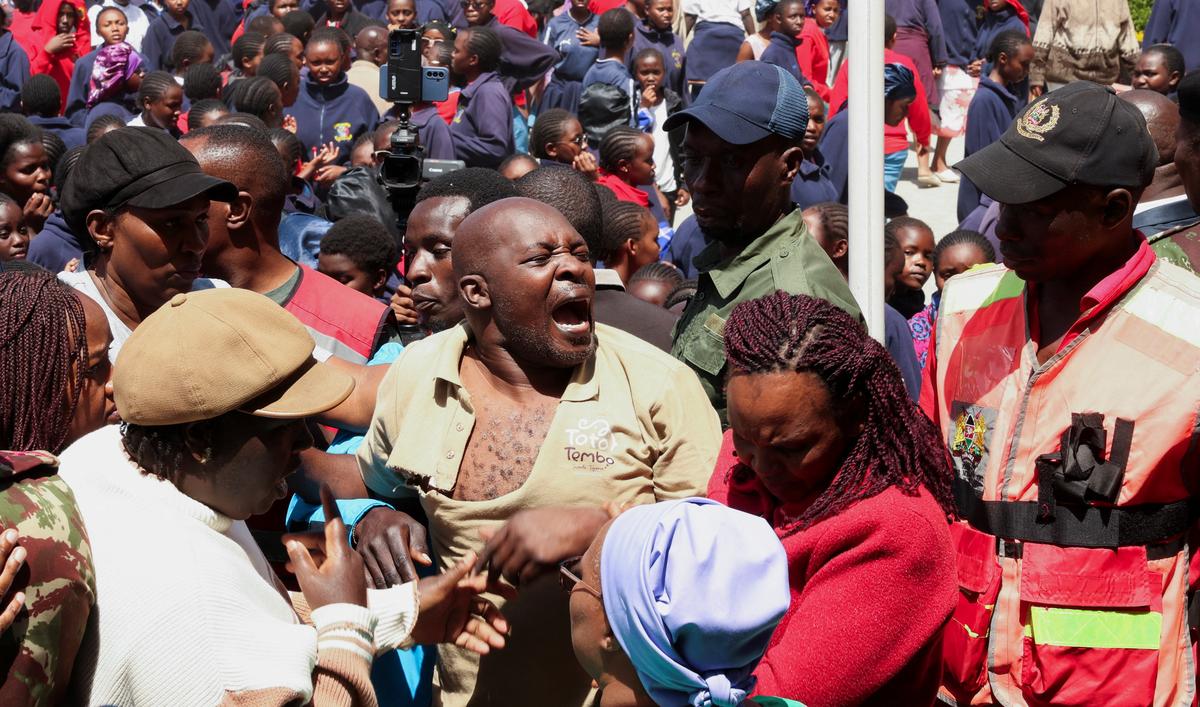 A parent reacts at the Utumishi Girls' Academy Senior School following an overnight fire a dormitory in Gilgil, Nakuru county, Kenya May 28, 2026. REUTERS/Monicah Mwangi