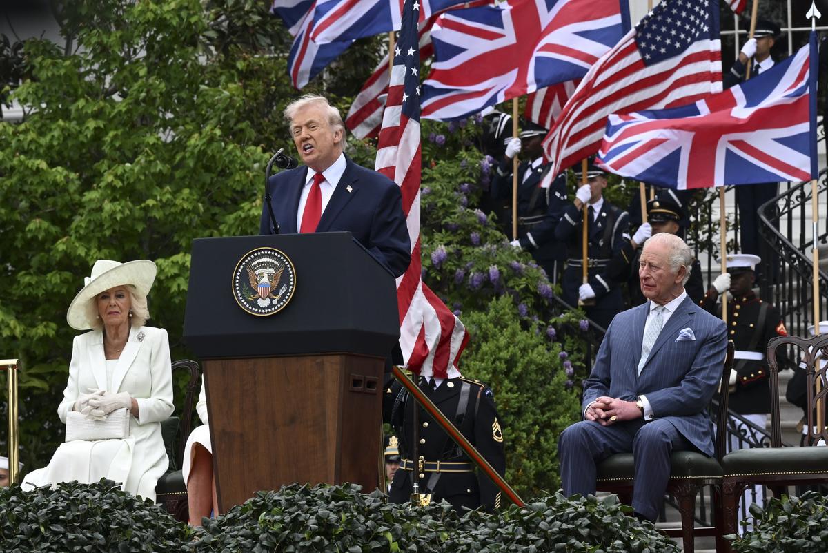 President Donald Trump speaks during an arrival ceremony for King Charles III, right, and Queen Camilla, left, on the South Lawn of the White House in Washington, on Tuesday, April 28, 2026. (Kenny Holston/The New York Times)