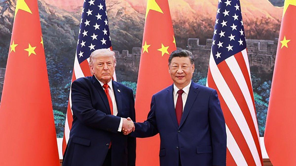 U.S. President Donald Trump (L) departed from Beijing on Friday after a two-day summit. In this photo from Thursday, he shakes hands with China's President Xi Jinping at the Great Hall of the People in Beijing. Photo by Chinese Foreign Ministry/UPI