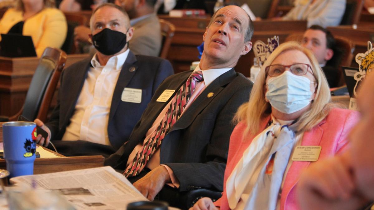 Kansas state Rep. Steven Johnson, center, R-Assaria, watches an electronic tally board in the Kansas House as it approves budget legislation, Friday, May 7, 2021, at the Statehouse in Topeka, Kan. Johnson is the Republican nominee for state treasurer. (AP Photo/John Hanna)