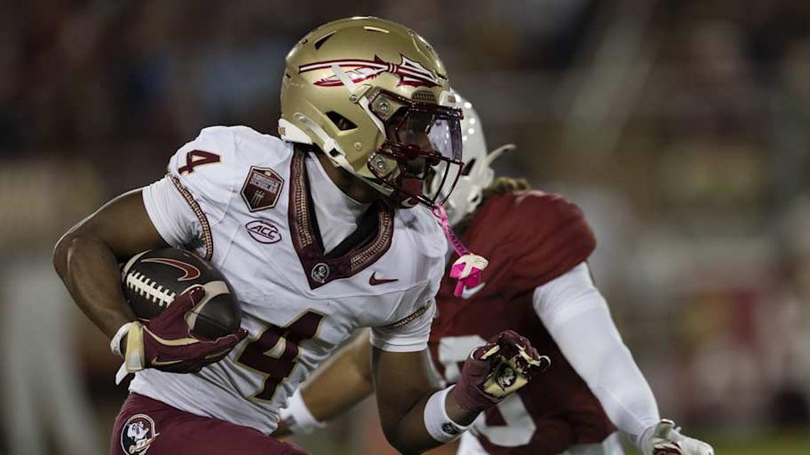  Oct 18, 2025; Stanford, California, USA; Florida State Seminoles wide receiver Squirrel White (4) runs with the ball during the third quarter against the Stanford Cardinal at Stanford Stadium. Mandatory Credit: Stan Szeto-Imagn Images | Stan Szeto-Imagn Images 