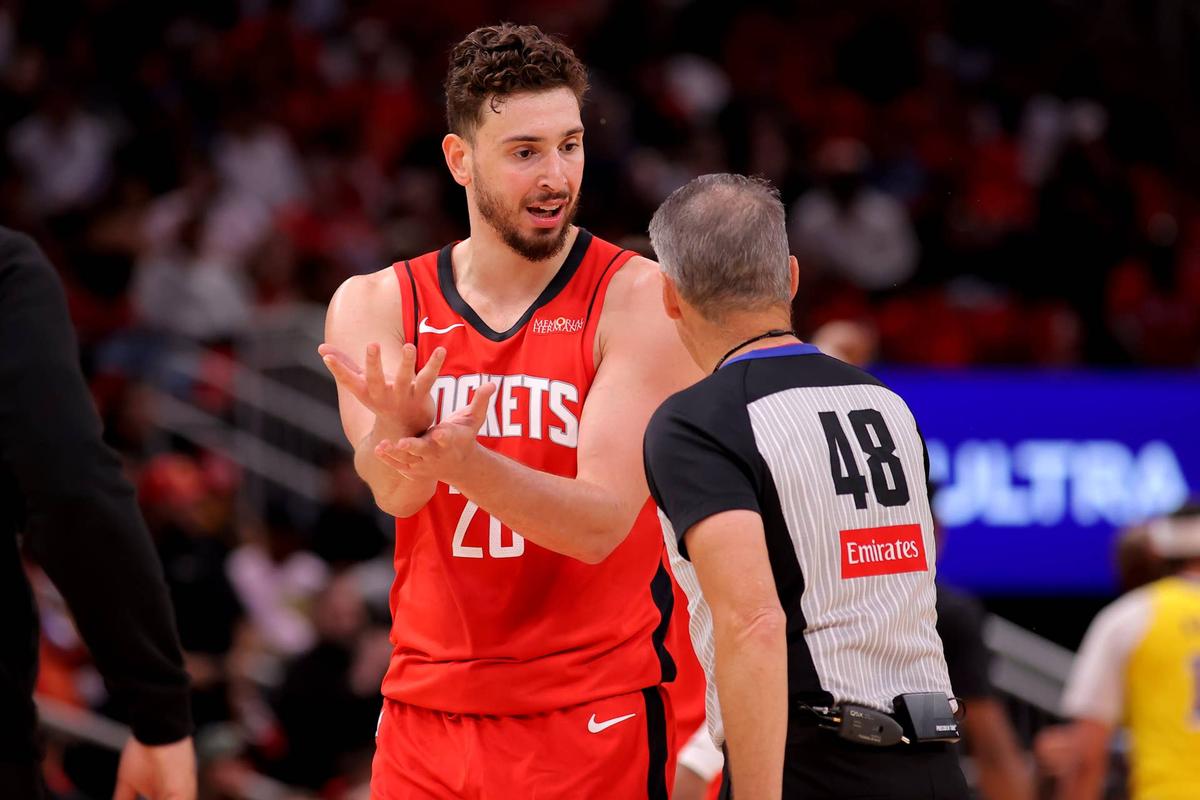  May 1, 2026; Houston, Texas, USA; Houston Rockets center Alperen Sengun (28) talks with NBA referee Scott Foster (48) during a timeout against the Los Angeles Lakers during the second quarter of game six of the first round of the 2026 NBA Playoffs at Toyota Center. Mandatory Credit: Erik Williams-Imagn Images 