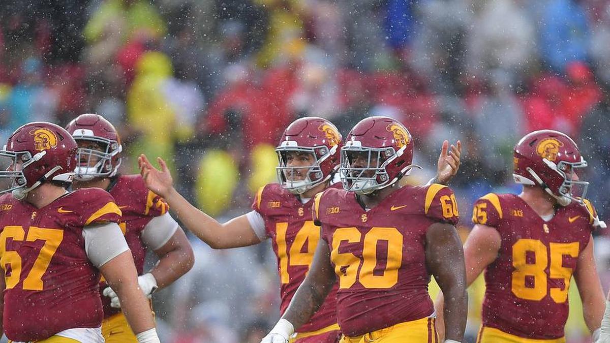  Nov 15, 2025; Los Angeles, California, USA; Southern California Trojans quarterback Jayden Maiava (14) celebrates the victory against the Iowa Hawkeyes at the Los Angeles Memorial Coliseum. Mandatory Credit: Gary A. Vasquez-Imagn Images | Gary A. Vasquez-Imagn Images 