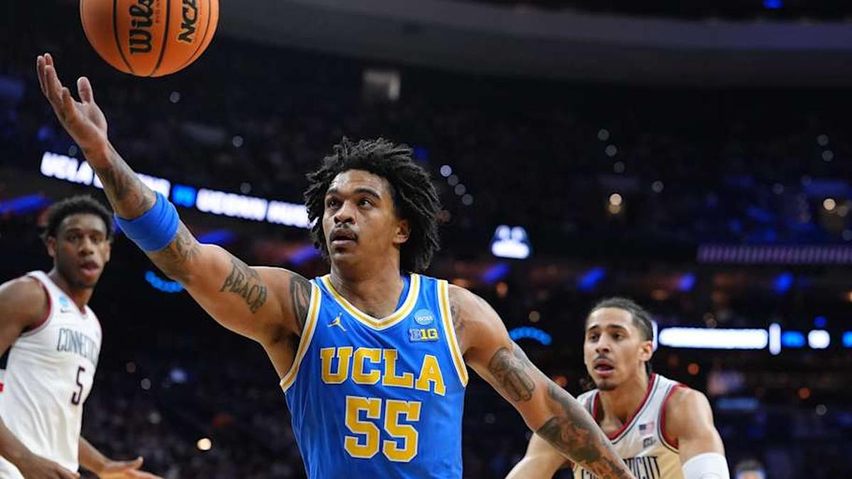  Mar 22, 2026; Philadelphia, PA, USA; UCLA Bruins guard Skyy Clark (55) reaches for a rebound against the UConn Huskies in the first half during a second round game of the men's 2026 NCAA Tournament at Xfinity Mobile Arena. Mandatory Credit: Kyle Ross-Imagn Images | Kyle Ross-Imagn Images 