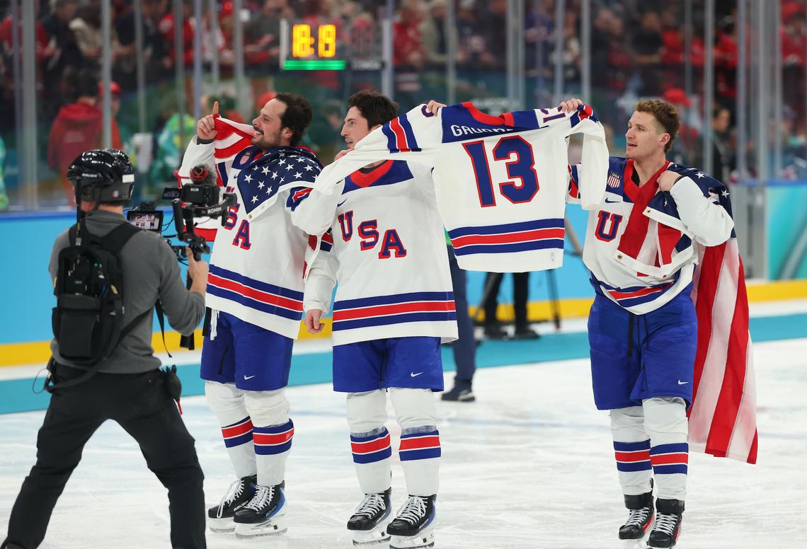  Auston Matthews, Zach Werenski and Matthew Tkachuk hold up a ‘Gaudreau 13' jersey.Gregory Shamus/Getty Images 