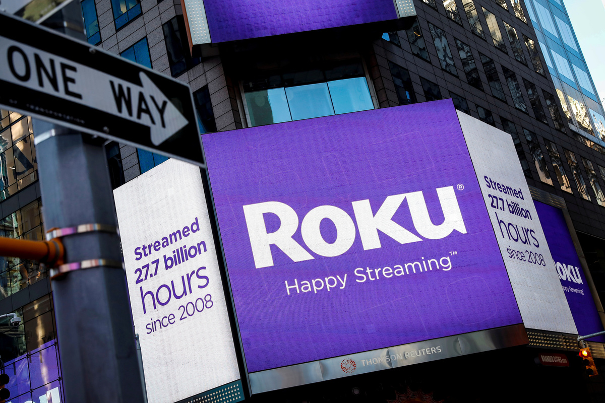 A video sign displays the logo for Roku Inc. in Times Square after the company's IPO at the Nasdaq Market in New York City on Sept. 28, 2017. Fox Corp is buying the streaming platform in a cash-and-stock deal valued at about $22 billion.