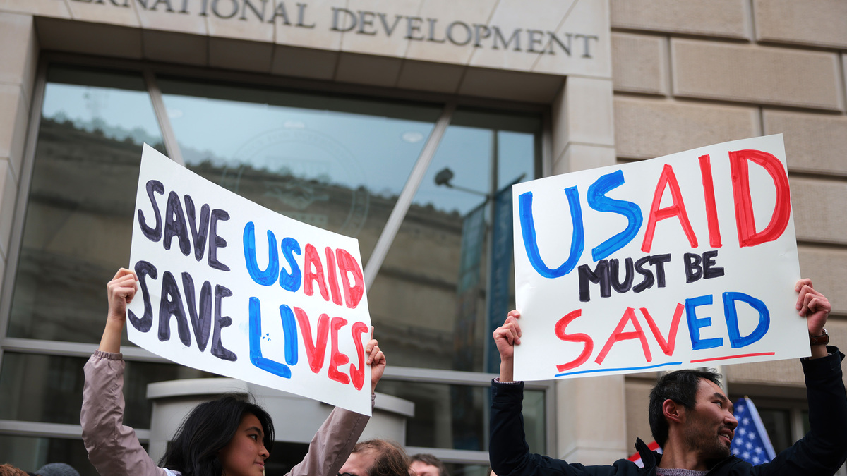 Protestors gather outside of USAID headquarters on Feb. 3, 2025, in Washington, D.C. Elon Musk, tech billionaire and head of the Department of Government Efficiency (DOGE), said in a social media post that he and U.S. President Donald Trump will shut down the foreign assistance agency. (Kayla Bartkowski/Getty Images/TNS)