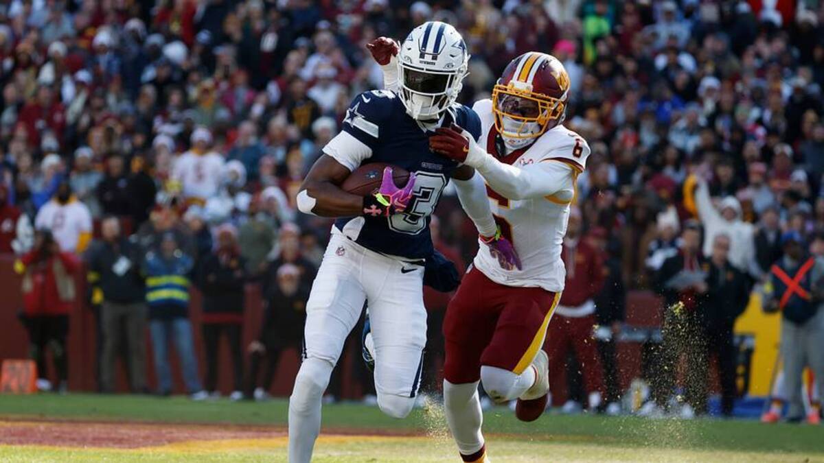  Dec 25, 2025; Landover, Maryland, USA; Dallas Cowboys wide receiver George Pickens (3) carries the ball as Washington Commanders cornerback Noah Igbinoghene (6) defends during the first half at Northwest Stadium. Mandatory Credit: Amber Searls-Imagn Images | IMAGN IMAGES via Reuters Connect 