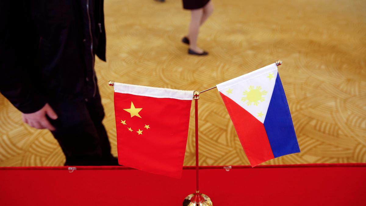 FILE PHOTO: National flags of China and the Philippines are seen in Beijing, China, January 23, 2017. REUTERS/Damir Sagolj/File Photo