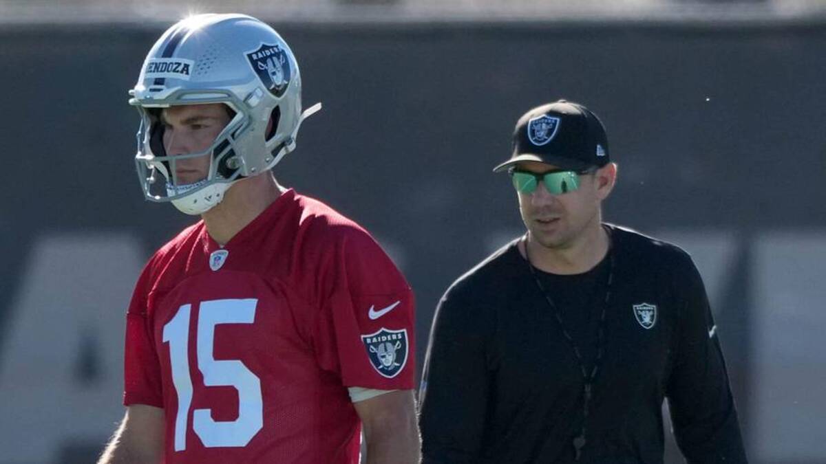  Jun 9, 2026; Henderson, NV, USA; Las Vegas Raiders quarterback Fernando Mendoza (15) and coach Klint Kubiak during minicamp at Intermountain Health Performance Center. Mandatory Credit: Kirby Lee-Imagn Images | Kirby Lee-Imagn Images 