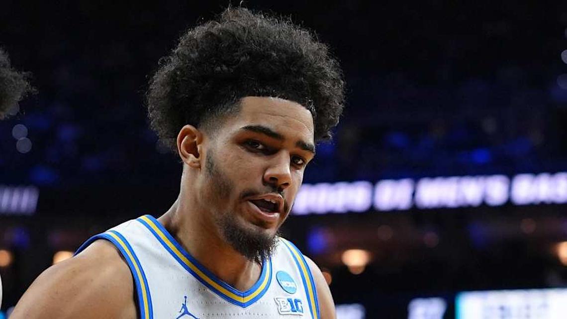  Mar 20, 2026; Philadelphia, PA, USA; UCF Knights forward Jamichael Stillwell (4) grabs a rebound against UCLA Bruins guard Eric Freeny (8) in the second half during a first round game of the men's 2026 NCAA Tournament at Xfinity Mobile Arena. Mandatory Credit: Kyle Ross-Imagn Images | Kyle Ross-Imagn Images 