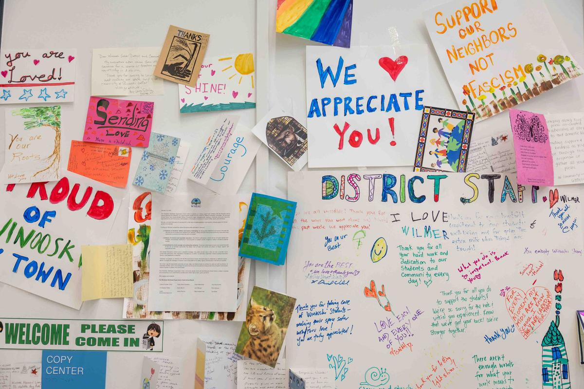  Letters of support hang on the walls of the Winooski School District. The district received a deluge of racist threats in December after raising the Somali flag on school grounds in December. Photographed on April 7, 2026. Credit: Oliver Parini for The Hechinger Report
