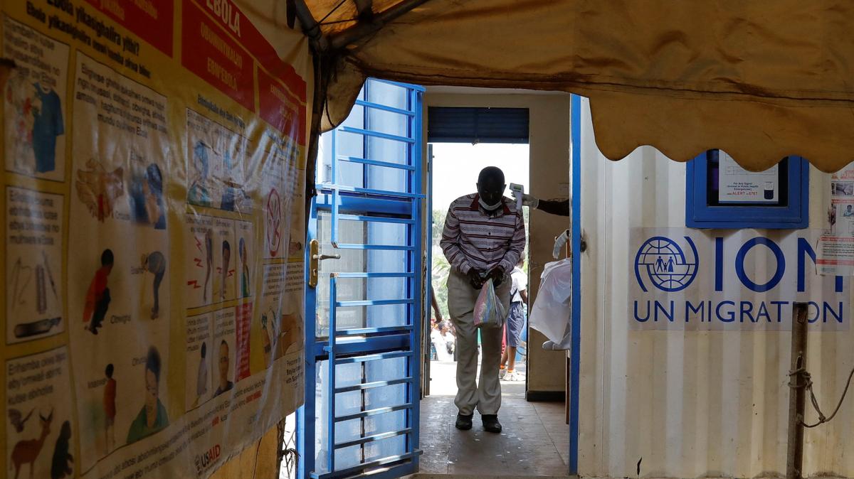 A man walks through a temperature checkpoint, after Uganda closed its borders with the Democratic Republic of Congo, as authorities intensify efforts to contain a new Ebola outbreak caused by the Bundibugyo virus strain, at the Mpondwe border post, in Kasese district, Uganda, May 28, 2026. REUTERS/Abubaker Lubowa