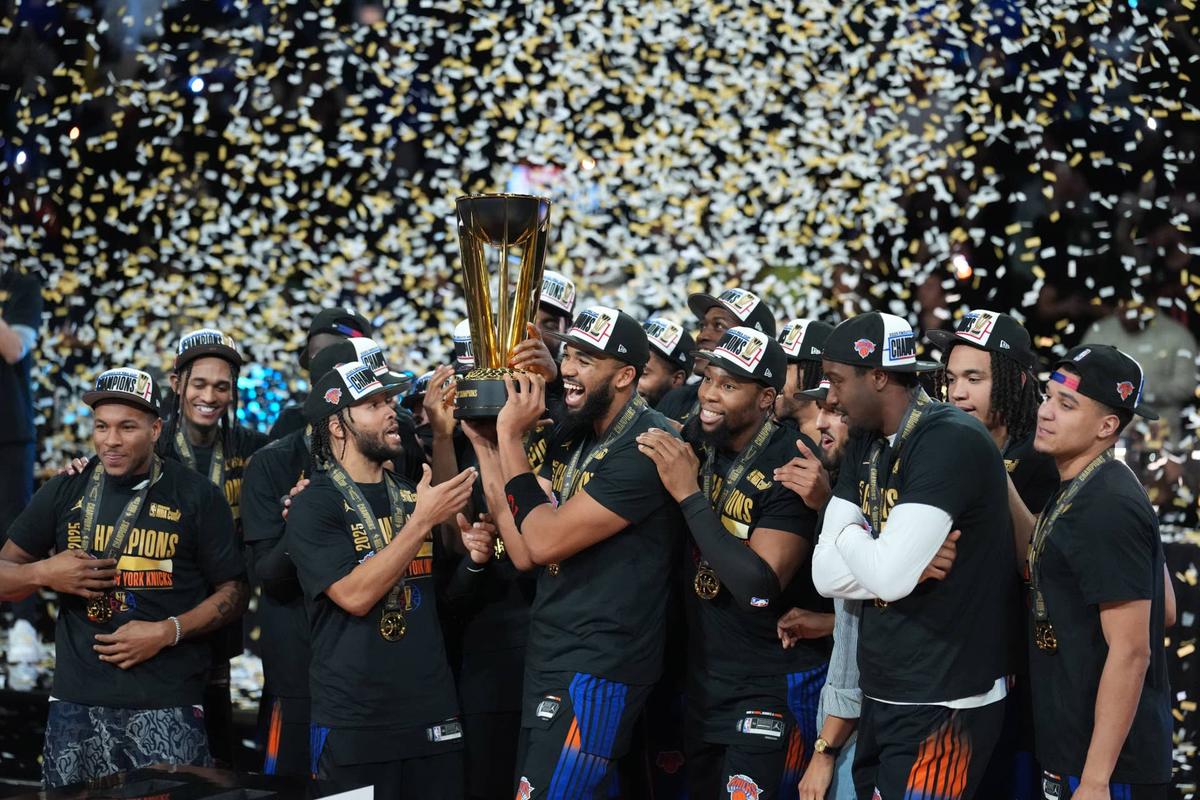  Dec 16, 2025; Las Vegas, Nevada, USA; New York Knicks center/forward Karl-Anthony Towns (32) and guard Jalen Brunson (11) hold the the Emirates NBA Cup trophy after victory over the San Antonio Spurs at T-Mobile Arena. Mandatory Credit: Kirby Lee-Imagn Images 